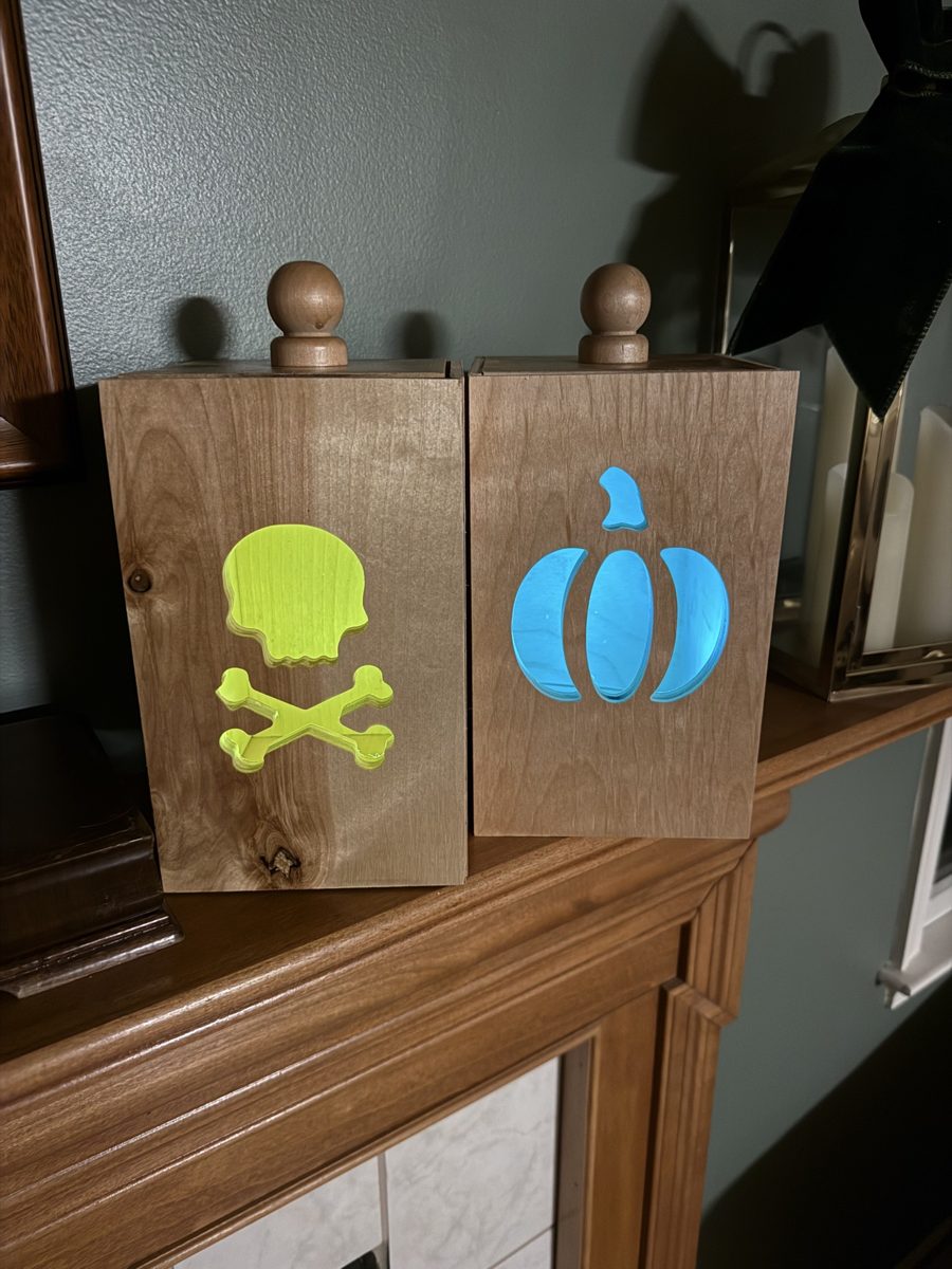 Skull n Bones and Pumpkin luminaries glowing lime and cyan